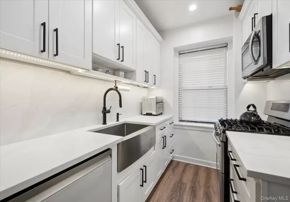 Newly Renovated Kitchen w/ White Cabinetry, Stainless Steel Appliances. Newly Renovated Kitchen w/ White Cabinetry, Stainless Steel Appliances.