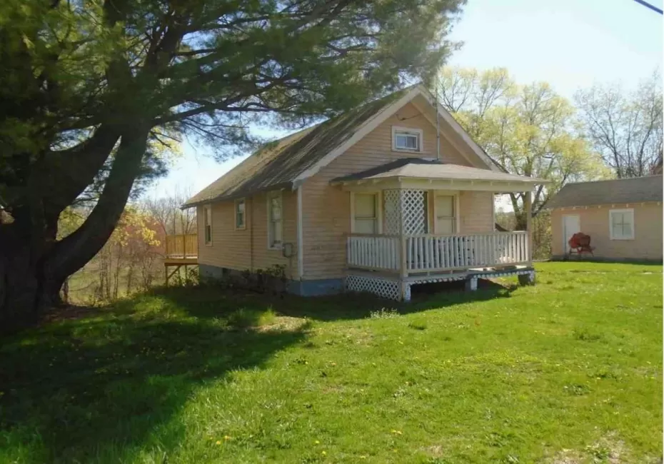 View of front of property featuring a front lawn and the house View of front of property featuring a front lawn and the house