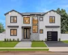 Contemporary exterior featuring white vertical siding, black-framed windows, a two-car garage with a modern door, a stone-clad entry, and a paved walkway Contemporary exterior featuring white vertical siding, black-framed windows, a two-car garage with a modern door, a stone-clad entry, and a paved walkway