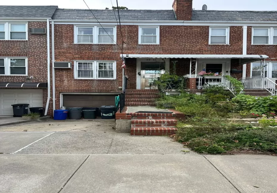 Front view of the home with driveway ,and landscaped entrance Front view of the home with driveway ,and landscaped entrance