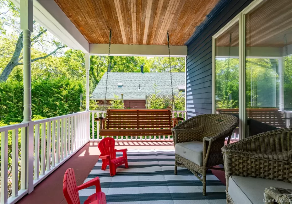 Inviting Covered Front Porch with Courtship Swing Inviting Covered Front Porch with Courtship Swing