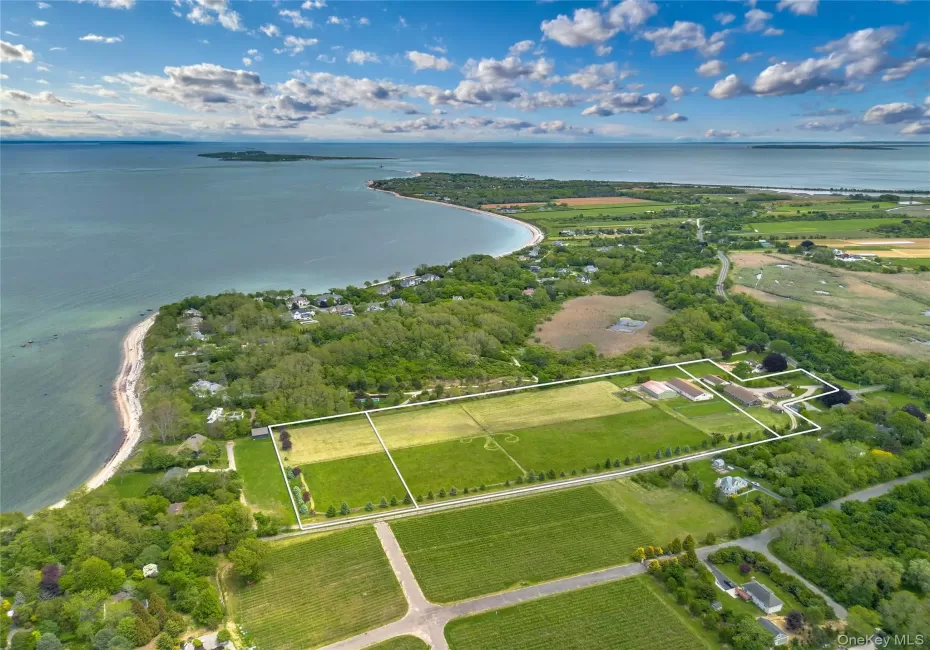 Aerial overview of property's location featuring property parcel outlined and a large body of water Aerial overview of property's location featuring property parcel outlined and a large body of water