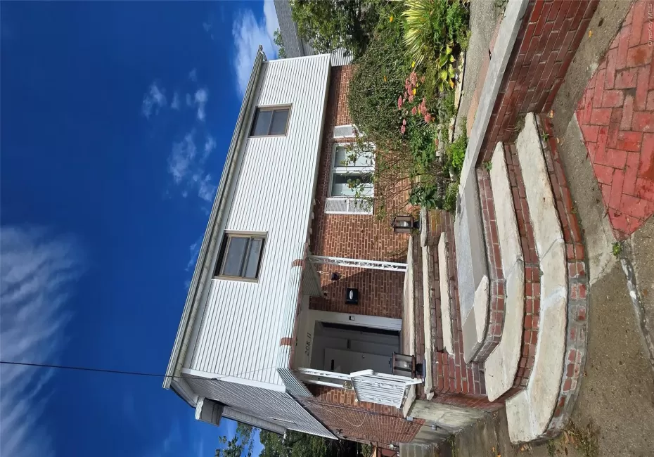 Brick and siding facade with a covered entry Brick and siding facade with a covered entry