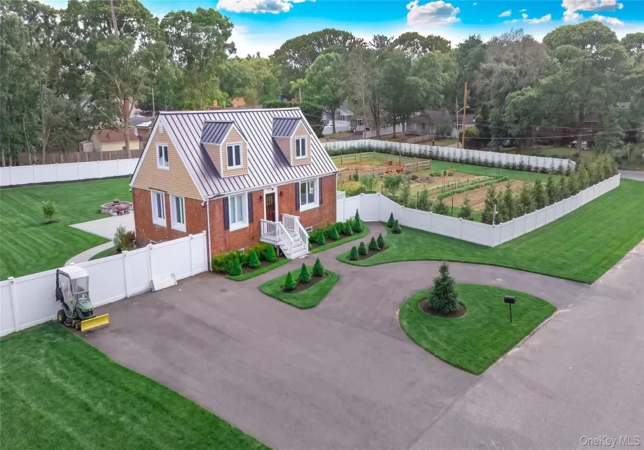 Property offers a circular driveway, plus an additional side driveway for added parking and convenience. Property offers a circular driveway, plus an additional side driveway for added parking and convenience.