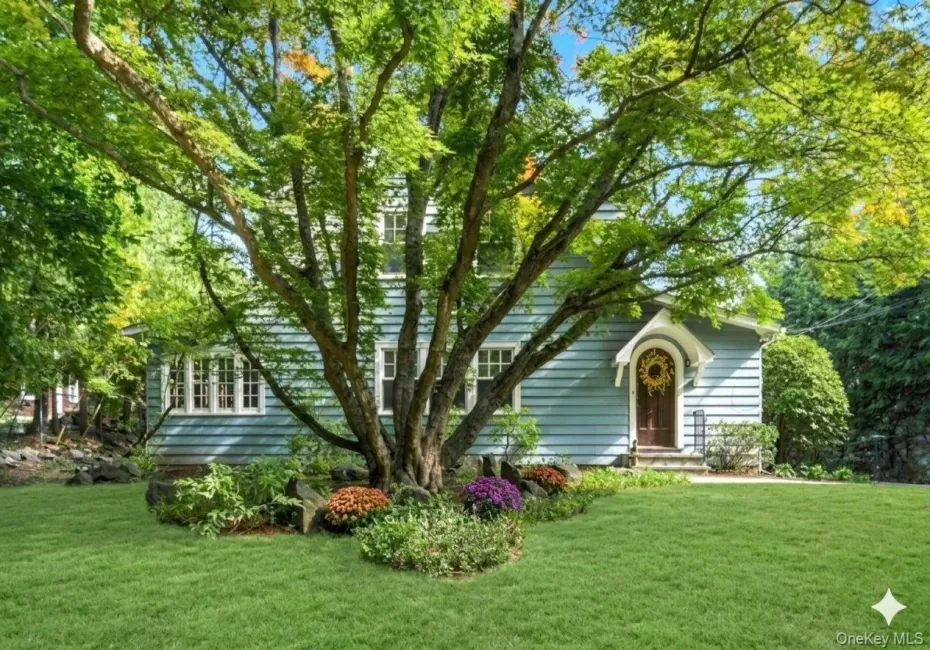 Picturesque Tudor-Revival home. Picturesque Tudor-Revival home.