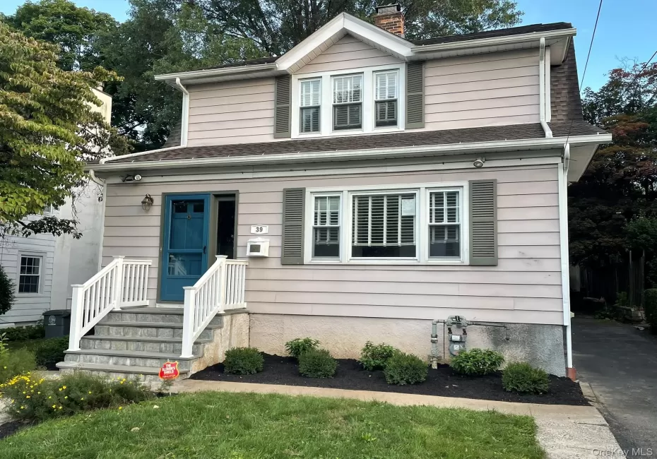 View of front of house with landscaping and a front yard View of front of house with landscaping and a front yard