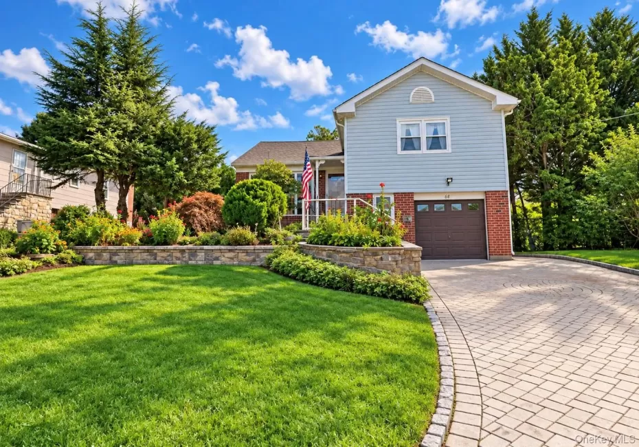 Light blue siding with brick accents Light blue siding with brick accents