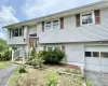 Bi-level home featuring an attached garage Bi-level home featuring an attached garage