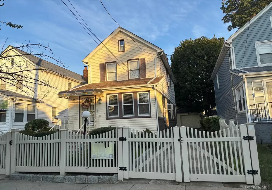 View of front of house with a gate and a fenced front yard View of front of house with a gate and a fenced front yard