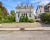 Two-story residence with dormer windows and a gabled roofline Two-story residence with dormer windows and a gabled roofline