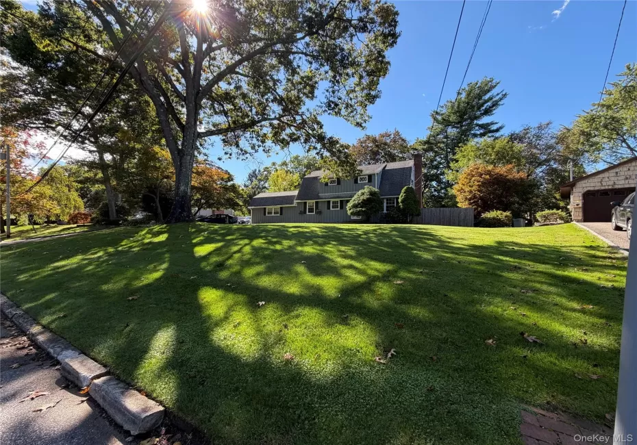 Colonial home, well set back, mature landscape, front lawn Colonial home, well set back, mature landscape, front lawn