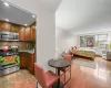 Kitchen featuring wood cabinetry, stainless steel appliances, and granite countertops Kitchen featuring wood cabinetry, stainless steel appliances, and granite countertops