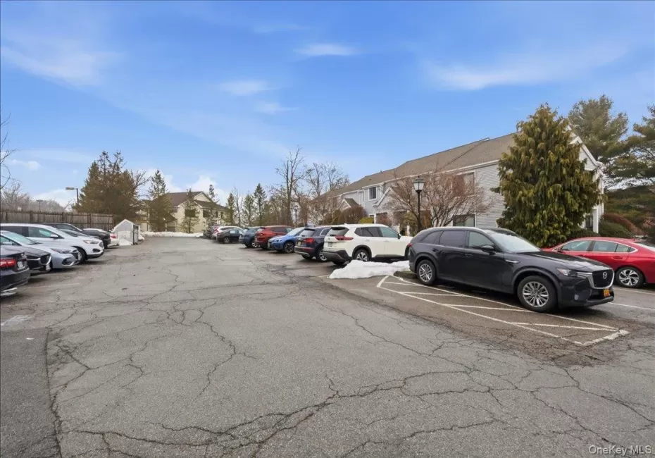 Uncovered parking lot with a residential view Uncovered parking lot with a residential view
