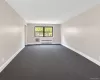 Expansive living room for hosting with access into the smaller bedroom Expansive living room for hosting with access into the smaller bedroom