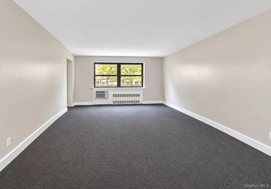 Expansive living room for hosting with access into the smaller bedroom Expansive living room for hosting with access into the smaller bedroom
