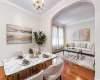 Crown molding, arched entryway, wood-finish flooring, and chandelier, Crown molding, arched entryway, wood-finish flooring, and chandelier,