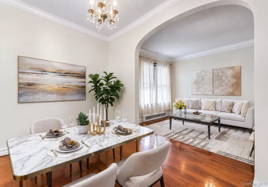 Crown molding, arched entryway, wood-finish flooring, and chandelier, Crown molding, arched entryway, wood-finish flooring, and chandelier,