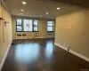 Recessed lighting, crown molding, wood-finish flooring, multiple windows, and a built-in air conditioning unit Recessed lighting, crown molding, wood-finish flooring, multiple windows, and a built-in air conditioning unit