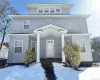 American foursquare style home featuring a porch American foursquare style home featuring a porch