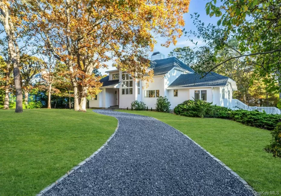 View of front of home with a front lawn and stucco siding View of front of home with a front lawn and stucco siding