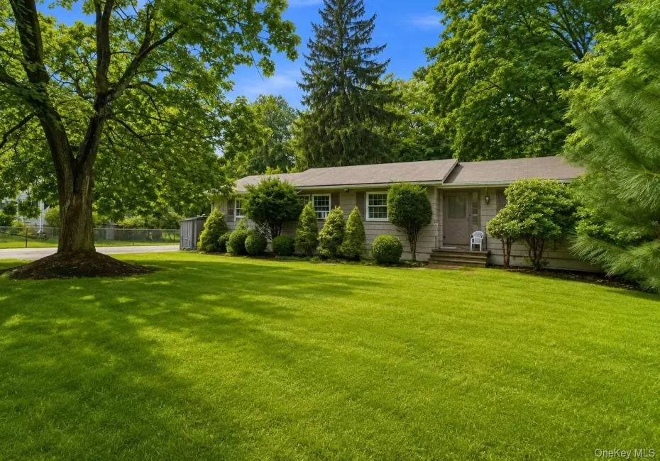 Expansive front lawn with mature trees and established landscaping Expansive front lawn with mature trees and established landscaping