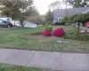 Manicured lawn with mature trees and vibrant landscaping Manicured lawn with mature trees and vibrant landscaping