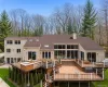 Multi-level outdoor deck system featuring composite decking and white railings Multi-level outdoor deck system featuring composite decking and white railings
