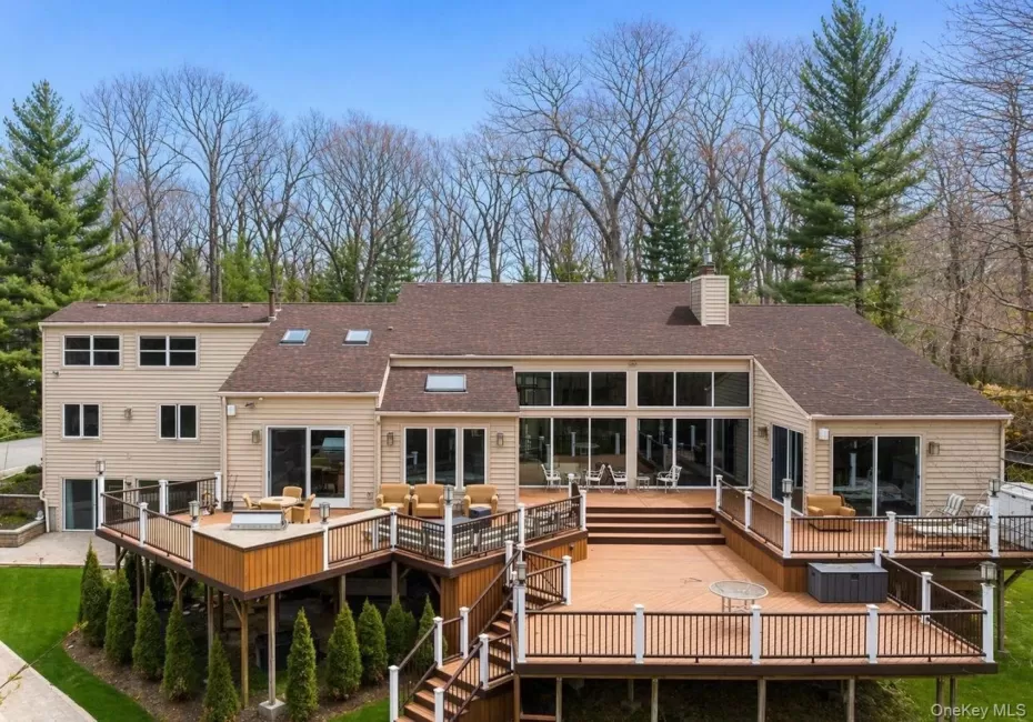 Multi-level outdoor deck system featuring composite decking and white railings Multi-level outdoor deck system featuring composite decking and white railings