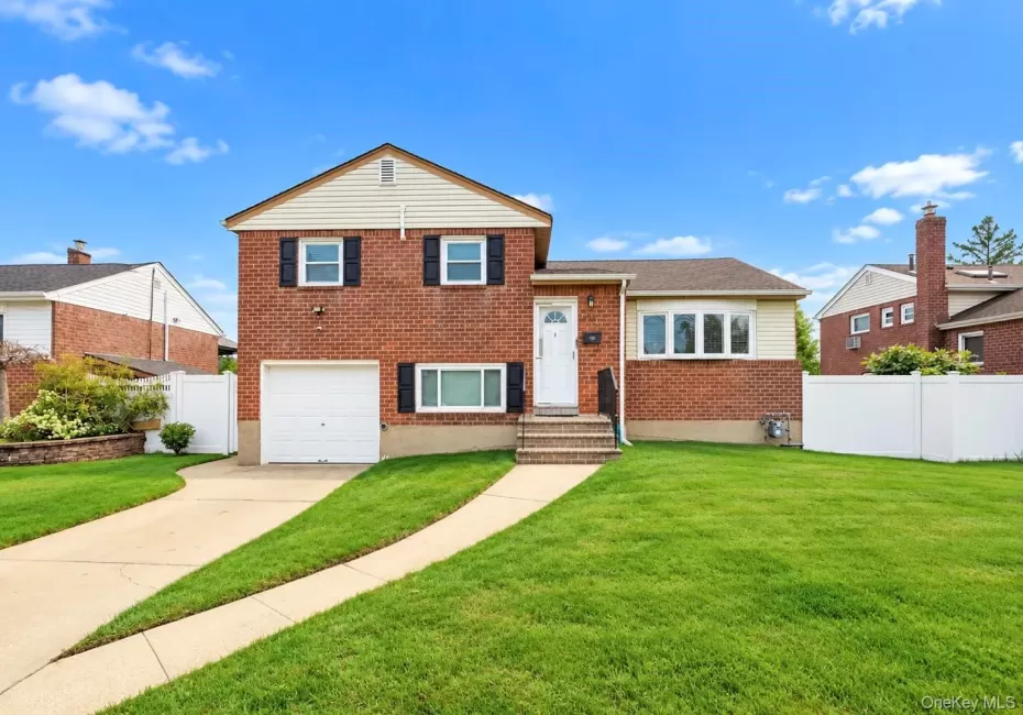 Brick exterior with white siding accents and dark shutters Brick exterior with white siding accents and dark shutters