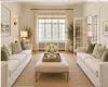 Virtually staged living room with views of the village Virtually staged living room with views of the village