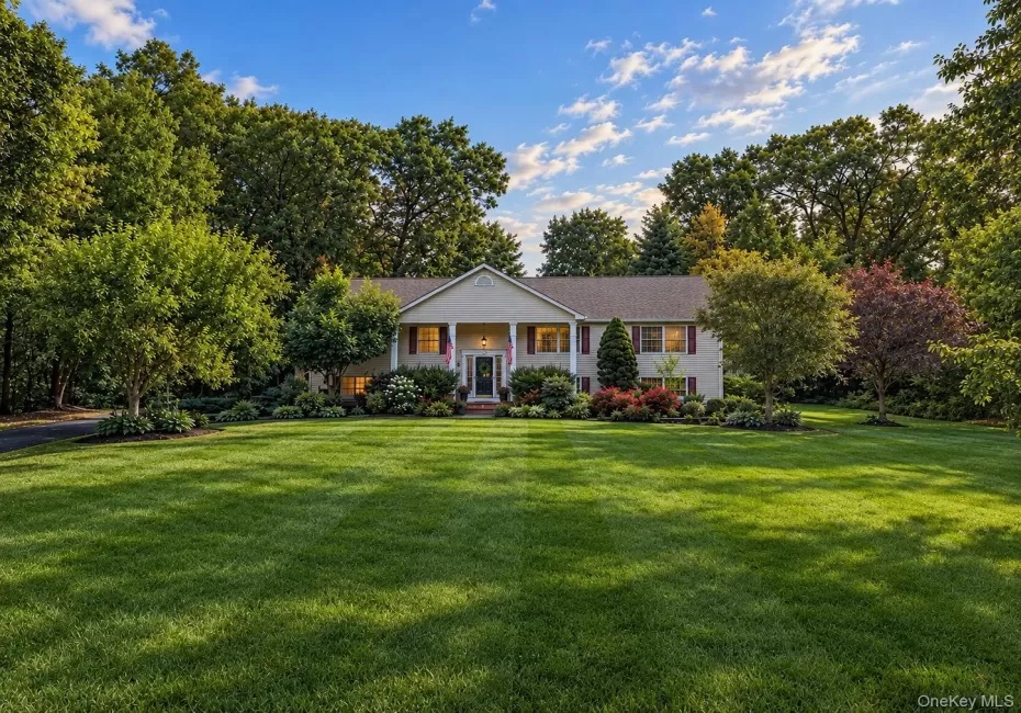 Expansive front lawn with mature trees and established landscaping Expansive front lawn with mature trees and established landscaping