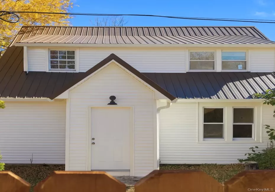View of front facade featuring a metal roof View of front facade featuring a metal roof