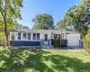 Single-story residence featuring a two-tone exterior, attached garage, and a front entrance with steps Single-story residence featuring a two-tone exterior, attached garage, and a front entrance with steps