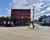 View of building exterior with uncovered parking View of building exterior with uncovered parking