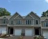 View of property featuring a garage View of property featuring a garage