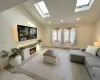 Living room with vaulted ceilings and skylights Living room with vaulted ceilings and skylights