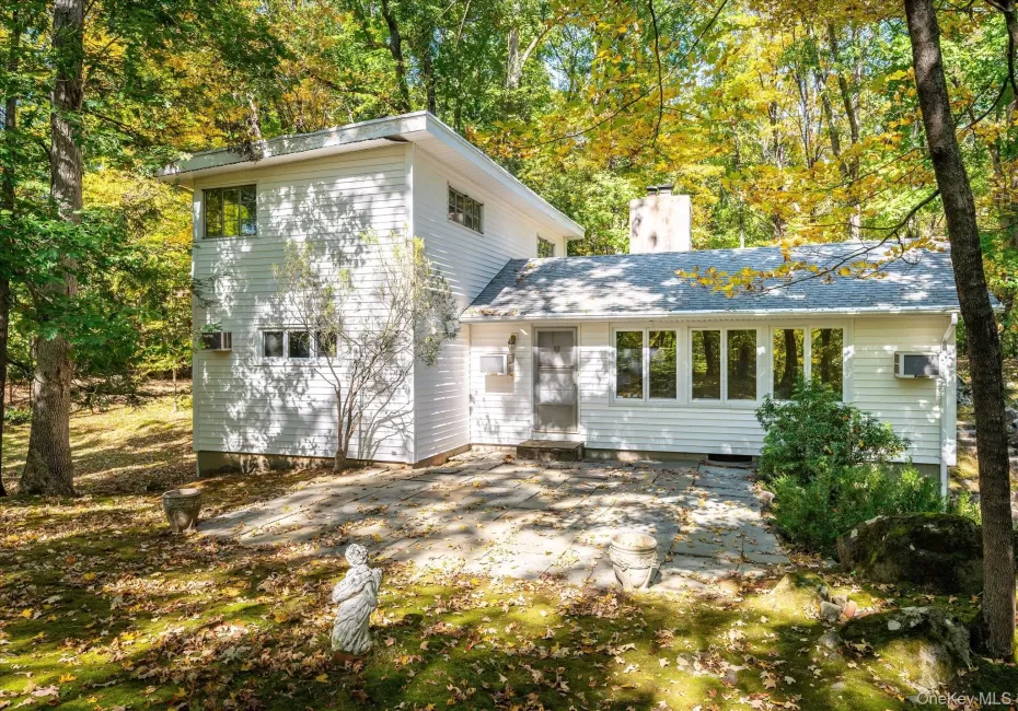 Set back in the woods on over 4 private acres in Huntersville Set back in the woods on over 4 private acres in Huntersville