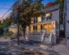 Stunning twilight exterior view of the front porch colonial, highlighting the warm lighting and inviting curb appeal. Stunning twilight exterior view of the front porch colonial, highlighting the warm lighting and inviting curb appeal.