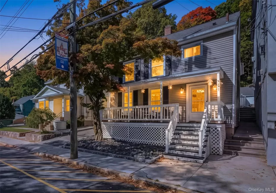 Stunning twilight exterior view of the front porch colonial, highlighting the warm lighting and inviting curb appeal. Stunning twilight exterior view of the front porch colonial, highlighting the warm lighting and inviting curb appeal.