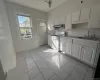 Kitchen with new appliances. Back door leading to porch and backyard Kitchen with new appliances. Back door leading to porch and backyard