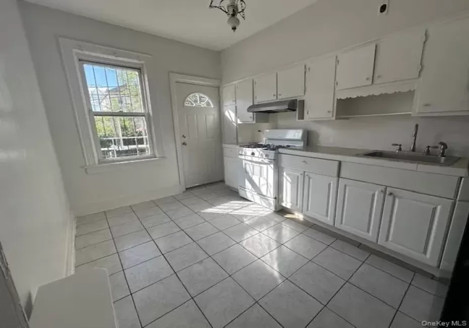 Kitchen with new appliances. Back door leading to porch and backyard Kitchen with new appliances. Back door leading to porch and backyard
