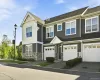 Unit 2105 includes the garage in the middle, and the four pictures on the second floor to the left Unit 2105 includes the garage in the middle, and the four pictures on the second floor to the left