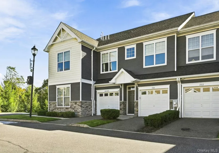 Unit 2105 includes the garage in the middle, and the four pictures on the second floor to the left Unit 2105 includes the garage in the middle, and the four pictures on the second floor to the left