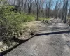 Entrance to the driveway on left Entrance to the driveway on left