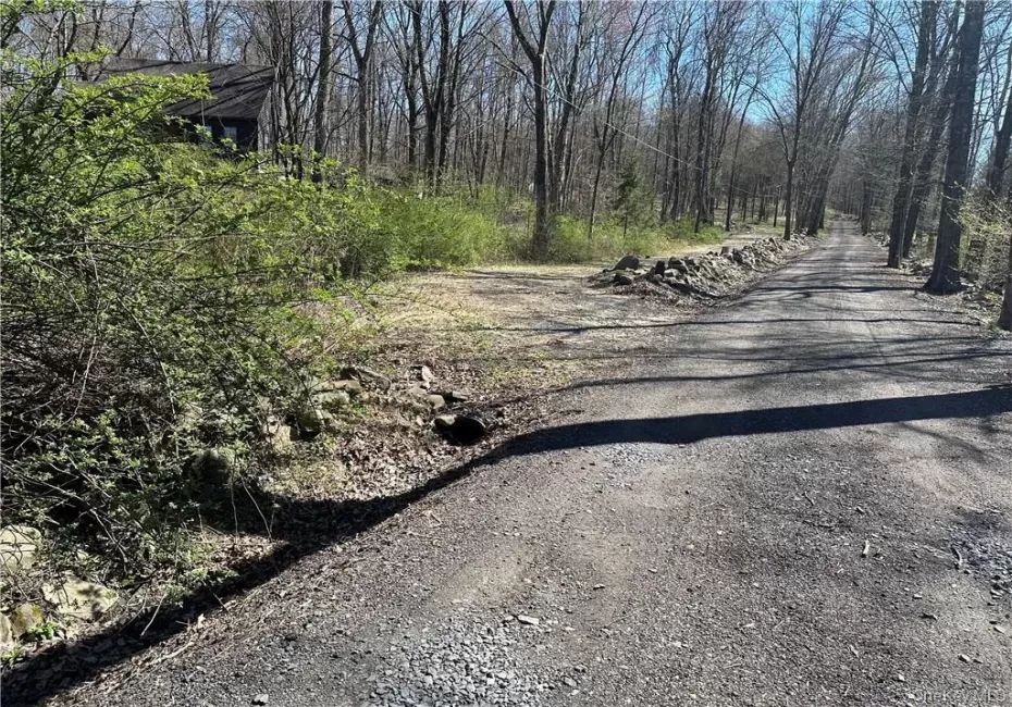 Entrance to the driveway on left Entrance to the driveway on left