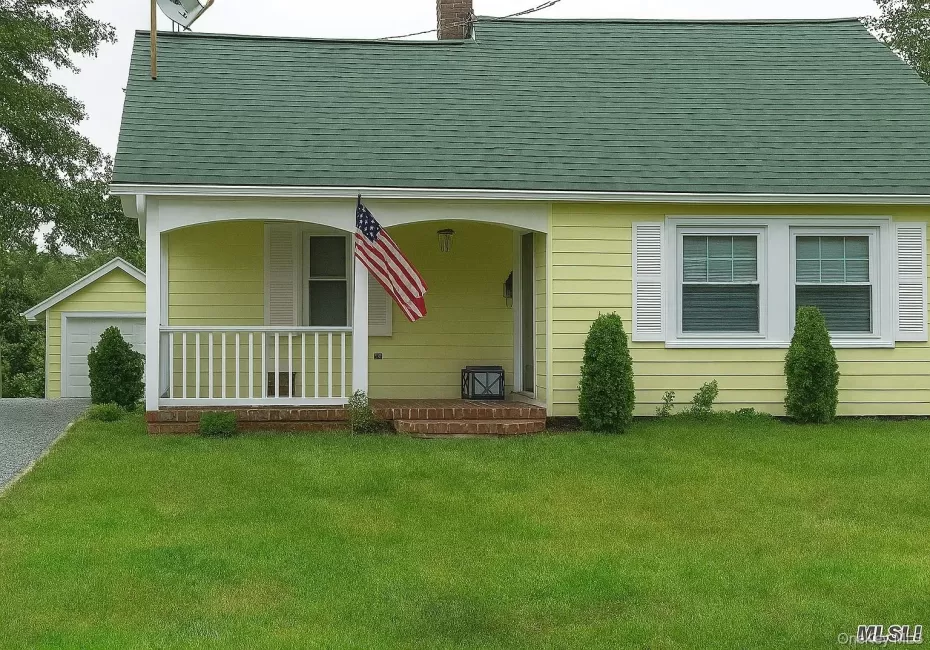 Front of home with porch and entry to living room. Front of home with porch and entry to living room.