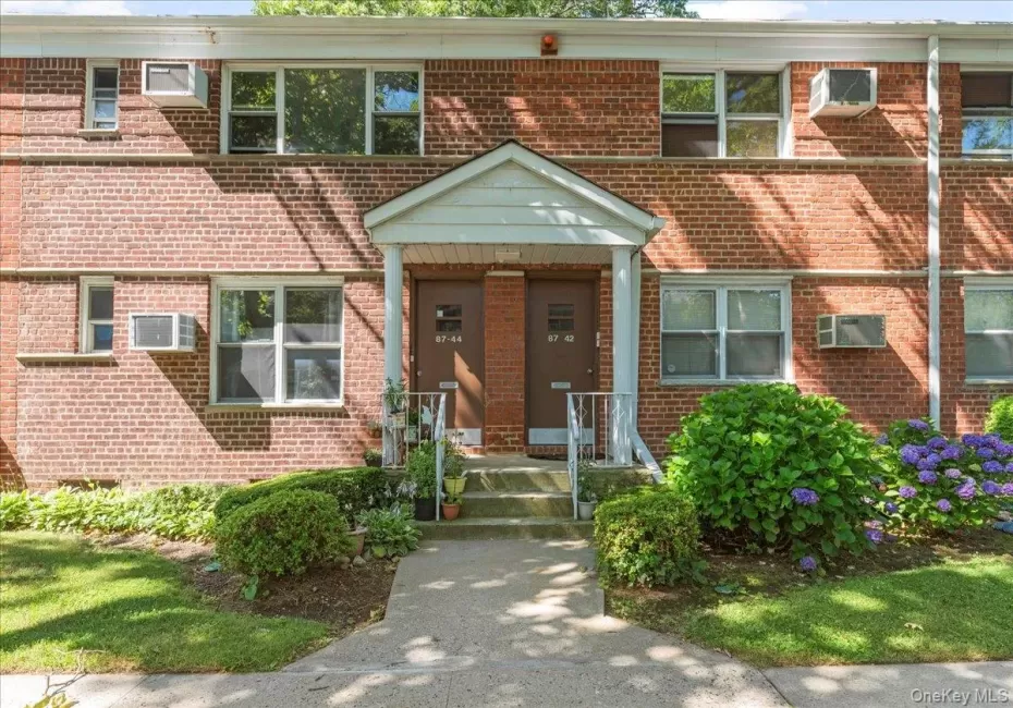 Property entrance with brick siding Property entrance with brick siding