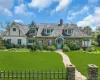 Stone and stucco exterior featuring a prominent teal front dutch door and complementary trim Stone and stucco exterior featuring a prominent teal front dutch door and complementary trim
