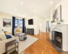 Virtually staged living room with working fireplace. Virtually staged living room with working fireplace.