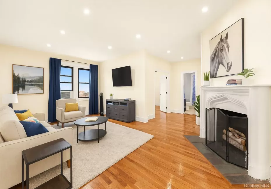 Virtually staged living room with working fireplace. Virtually staged living room with working fireplace.